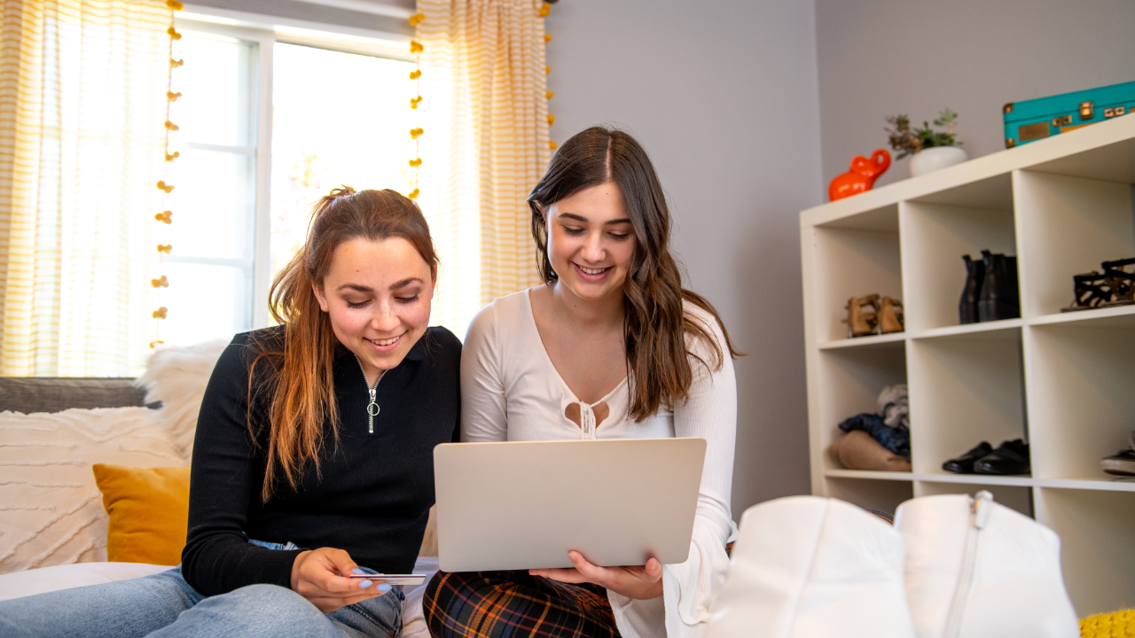 College freshmen girls shopping online with a credit card