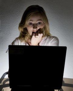taxes-blog-fearful-woman-looking-at-laptop