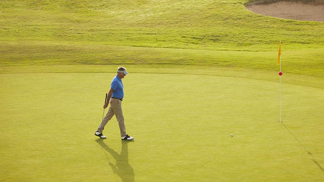 Man on golf course playing a game
