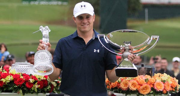 Jordan Spieth with his trophies after the final round of the 2015 Tour Championship in Atlanta. © Michael Wade/Icon Sportswire/Corbis