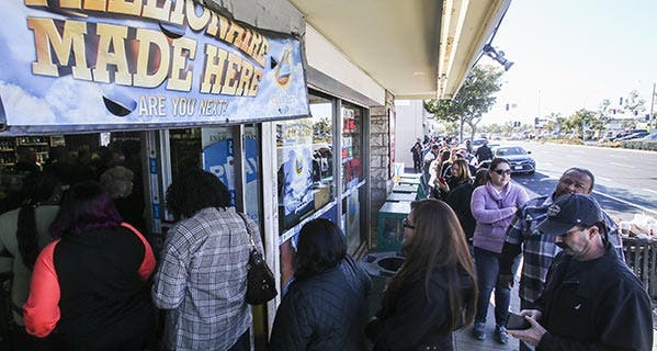 People line up to buy Powerball lottery tickets in Hawthorne, California. That state doesn't tax lottery winnings. © Ringo Chiu/ZUMA Press/Corbis