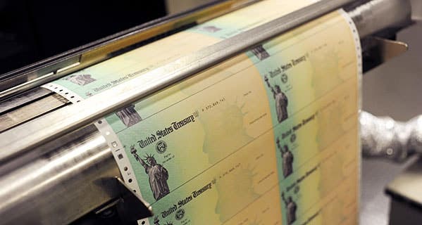 U.S. Treasury checks may be delayed a bit this year as the IRS ramps up efforts to fight tax refund fraud. William Thomas Cain/Getty Images