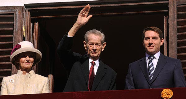 Former King of Romania Michael I makes a rare appearance saluting the audience with Princess Margareta and Prince Nicolae. KARINA KNAPEK/AFP/Getty Images