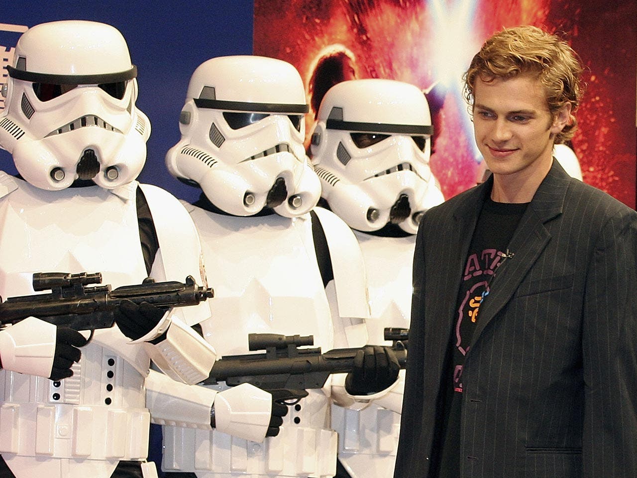Hayden Christensen stands with Stormtroopers during a photocall to promote the film