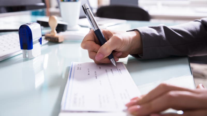 woman signing check