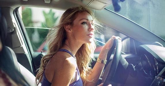 What are the pros and cons of leasing a car? Young woman driving her car | Cultura RM Exclusive/Seb Oliver/Getty Images