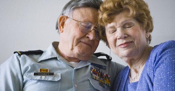 Pentagon wants to change military pensions further Senior military veteran resting head against wife | rubberball/Getty Images