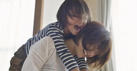 Parent celebrating a savings bond gift | Yagi Studio/DigitalVision/Getty Images