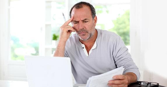 Older gentleman reading laptop © goodluz - Fotolia.com