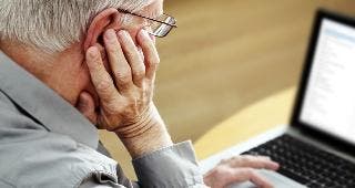 Man on computer © Mikael Damkier / Fotolia