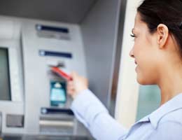 Woman using ATM