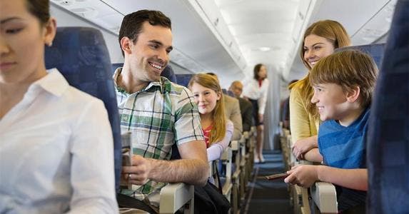 Top 10 investing tips for 2017 Family sitting together in plane | Hero Images/Getty Images