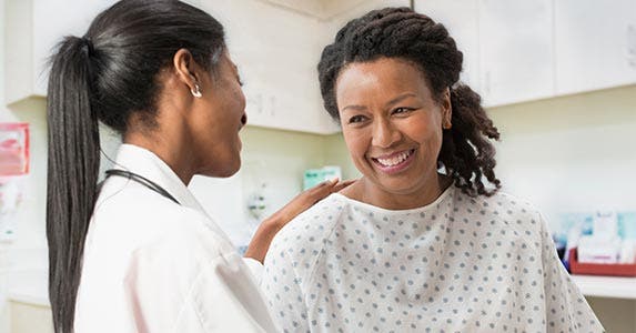 Woman getting check-up at doctor's office