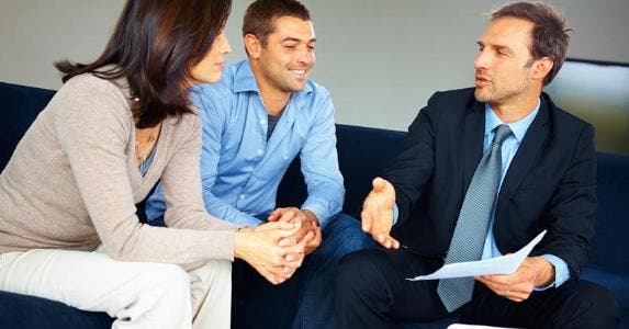 Private banking isn't just for the 1% anymore A couple sitting with their financial adviser © iStock