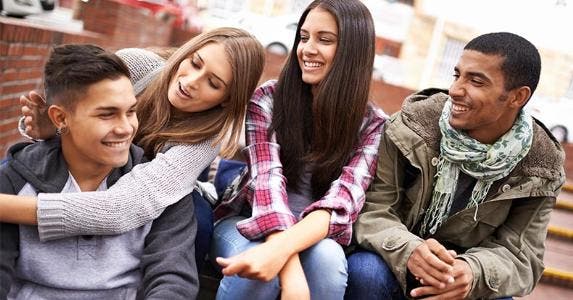 Many millennials didn't get the memo on investing Millennial friends hanging out | PeopleImages/Getty Images