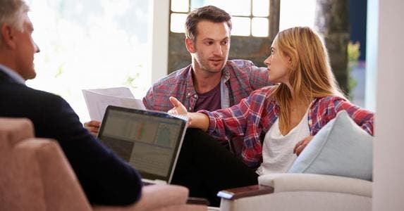 Couple talking to adviser © iStock