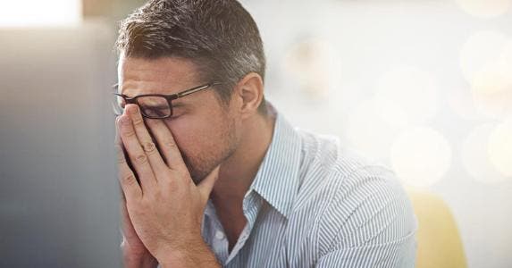 A zoning issue is blowing up my home purchase Stressed man holding bridge of nose | iStock.com