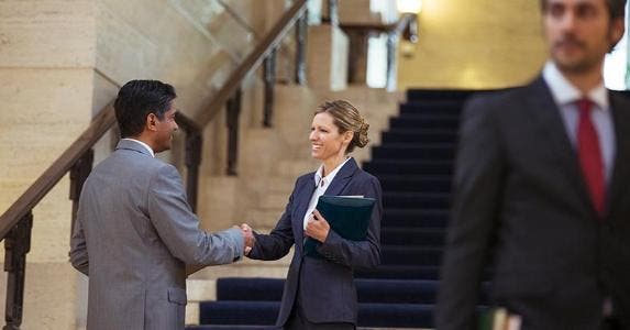 5 liens on my home and can't find soon-to-be ex's ex Two business people shaking hands | Paul Bradbury/Getty Images
