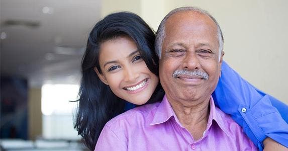The complications of gifting a home to family Father and daughter posing for photo | A and N photography/Shutterstock.com
