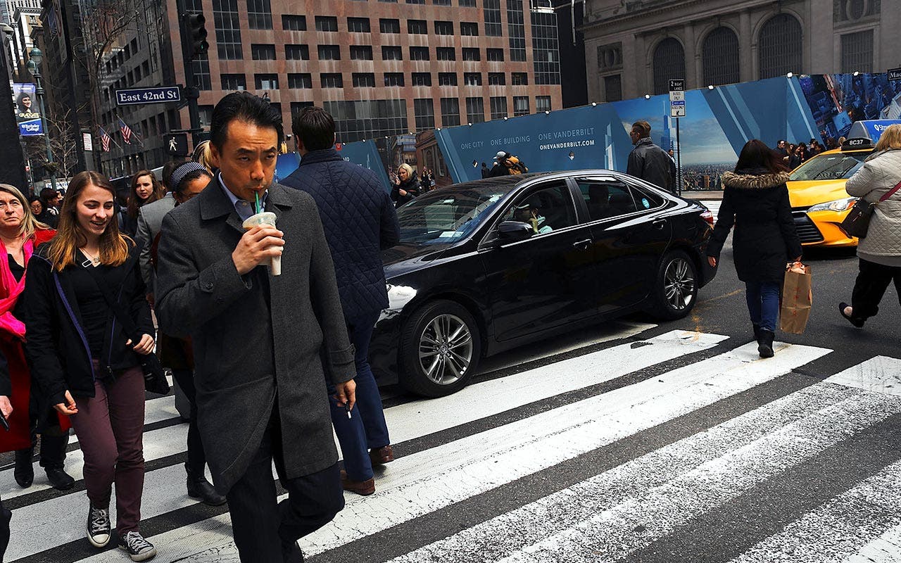Pedestrians in Manhattan crossing street