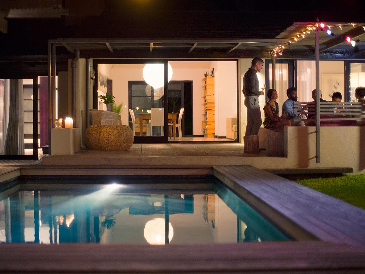 Inground pool in back yard of house