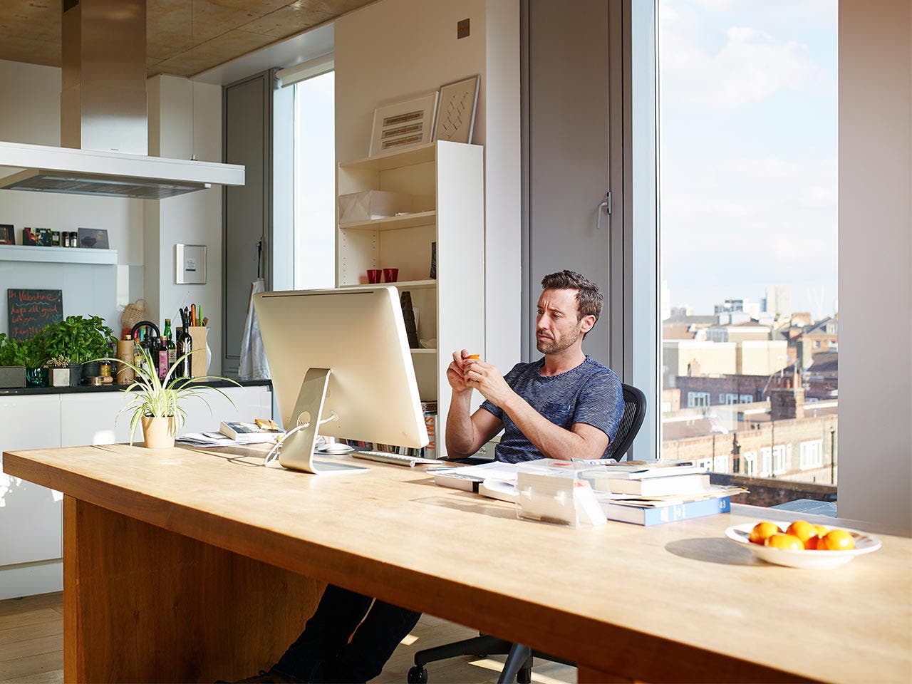 Man sitting at his desk at work, leaning back