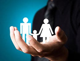 3. Work with an insurance agent to plan health coverage for your family if dependents aren't covered adequately by your employer plan. © Shutter_M/Shutterstock.com