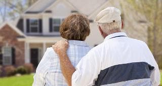 Senior couple looking at house © Andy Dean Photography/Shutterstock.com