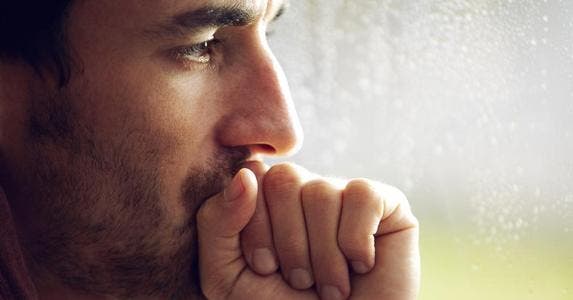 New umbrella insurance and an old accident Close-up shot of pensive man with facial hair