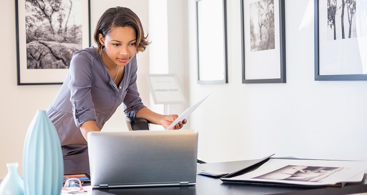 Woman looking at her laptop
