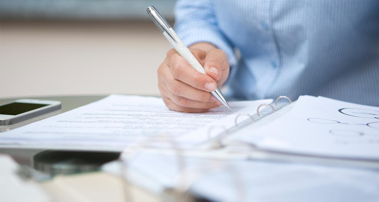 Man signing forms