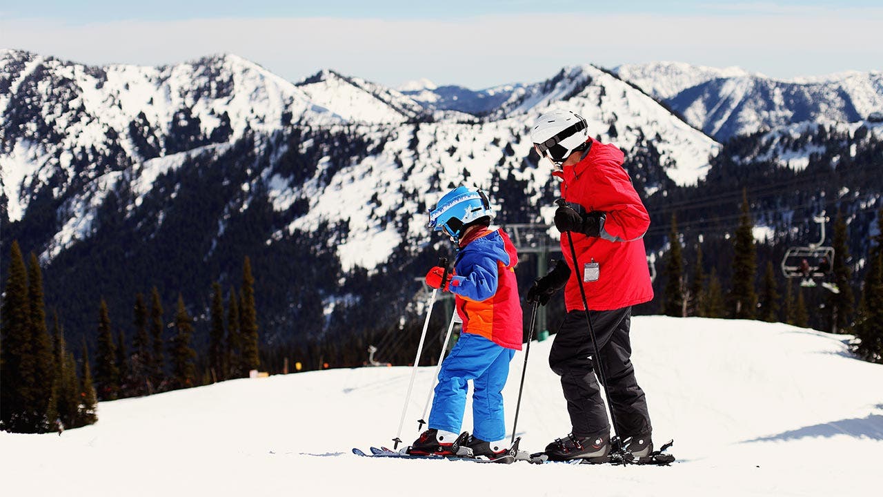 Adult and child on the slopes