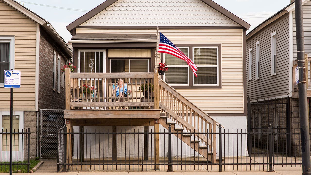 Family sitting on their patio, outside