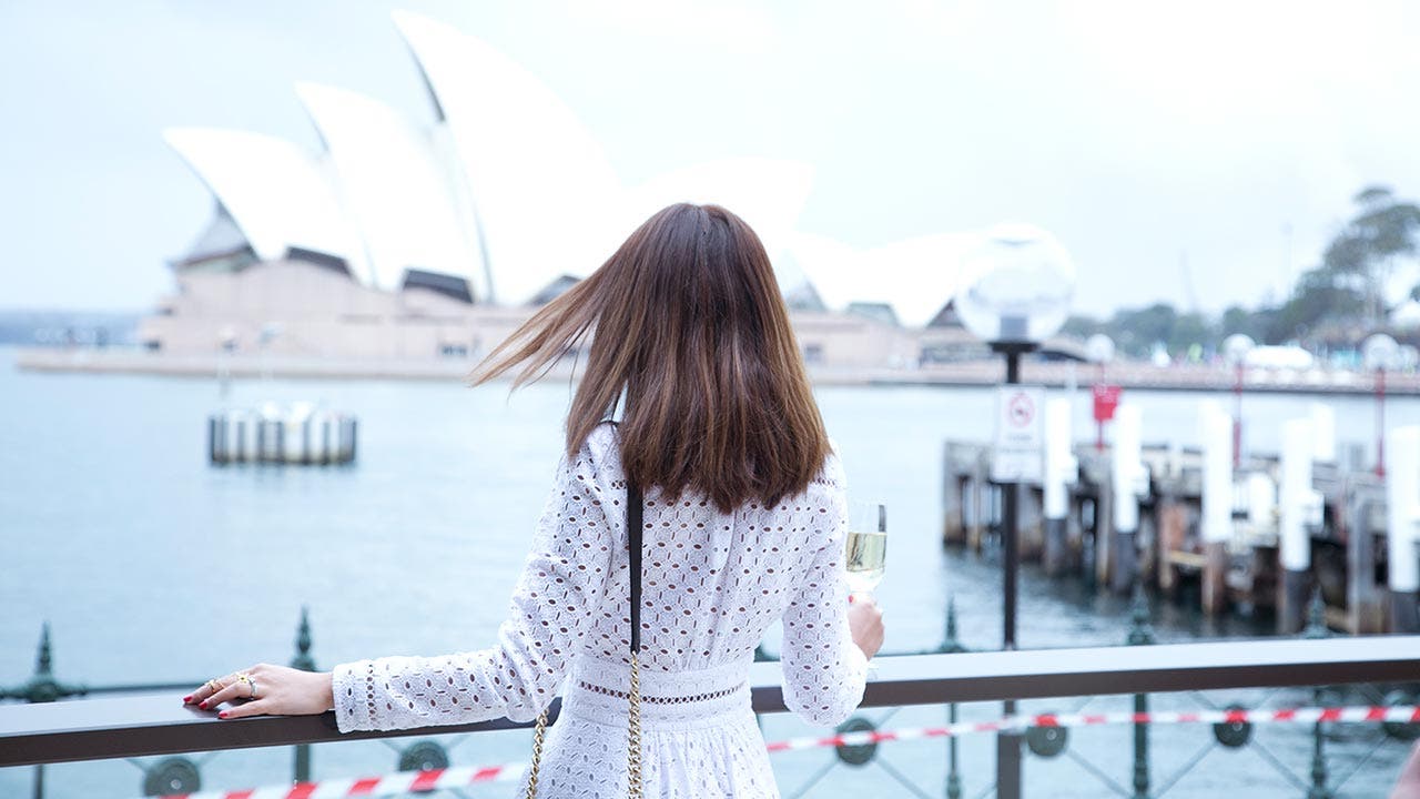 Woman looking at the Sydney Opera House