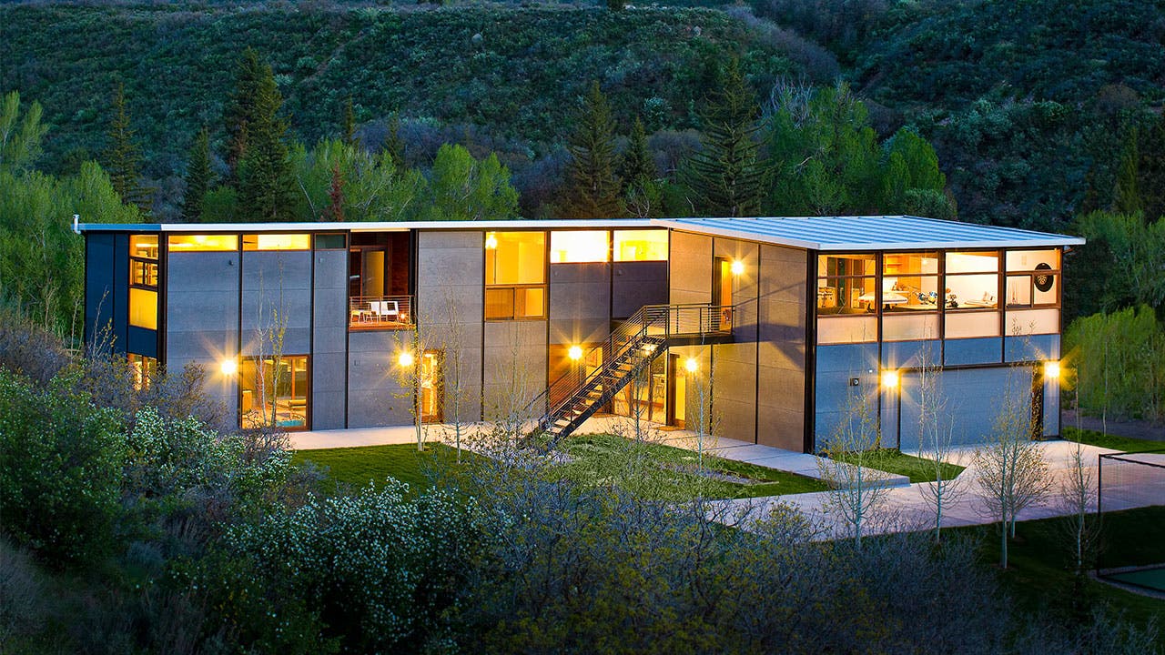 Large house in the woods at night