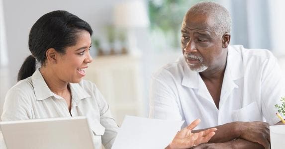 Taxes that lower your IRS bill Mature man listening to female adviser | JGI/Tom Grill/Getty Images