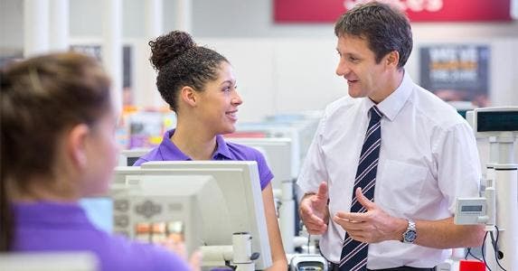 When teens owe money to Uncle Sam Teen talking to her manager at work | Echo/Getty Images