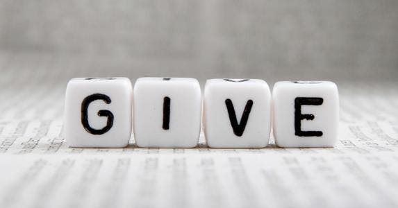 Year-end gifts to charity pay off at tax time The word 'give' on white cubes © schatzy/Shutterstock.com