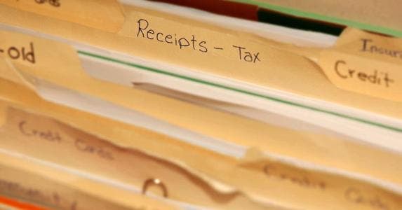 7 tips to help you hang on to crucial tax records Folder of tax receipts | iStock.com/Lanica Klein
