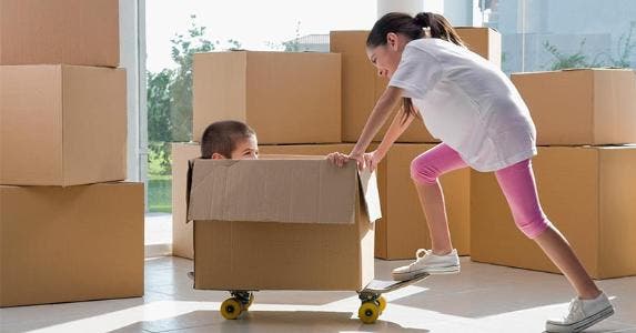 What is a car lease agreement? Children playing with moving boxes | Glow Images, Inc/Getty Images