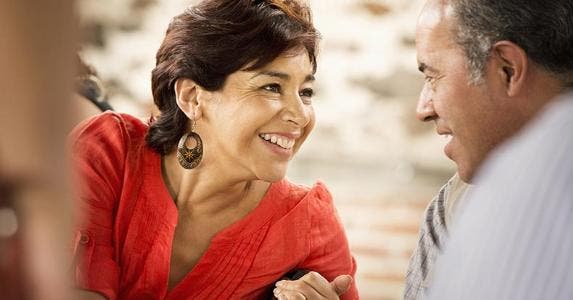 Claiming Mexican stepchildren as dependents on taxes Wife leaning over and talking to husband | Blend Images – Sollina Images/Brand X Pictures/Getty Images