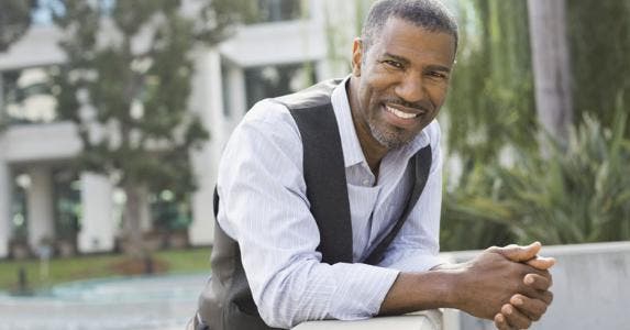 Veteran looks for tax relief from military pension Man smiling and leaning on a concrete railing | Hero Images/Getty Images