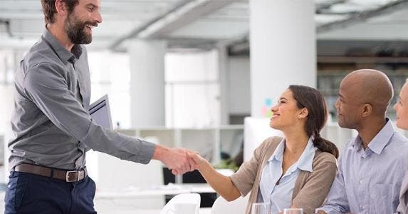 Businesses get tax credit for hiring veterans, others Employees shaking hands | PeopleImages.com/Getty Images