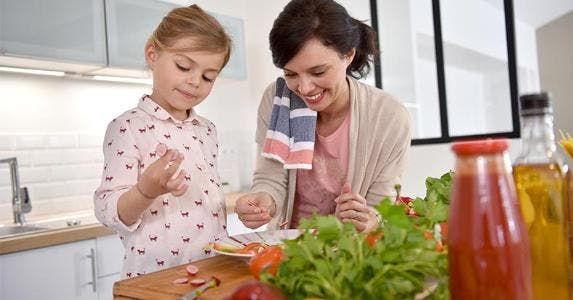 Does paying off home equity line impact tax on home? Mom preparing food with her child © goodluz/Shutterstock.com