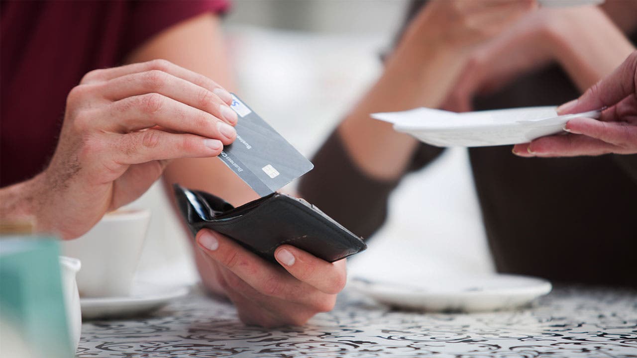 Man buying bill with a credit card