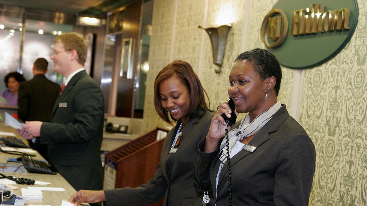Hotel worker answering phone