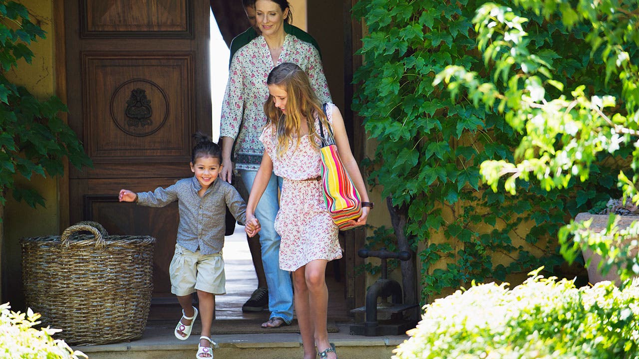 Family walking out of a house