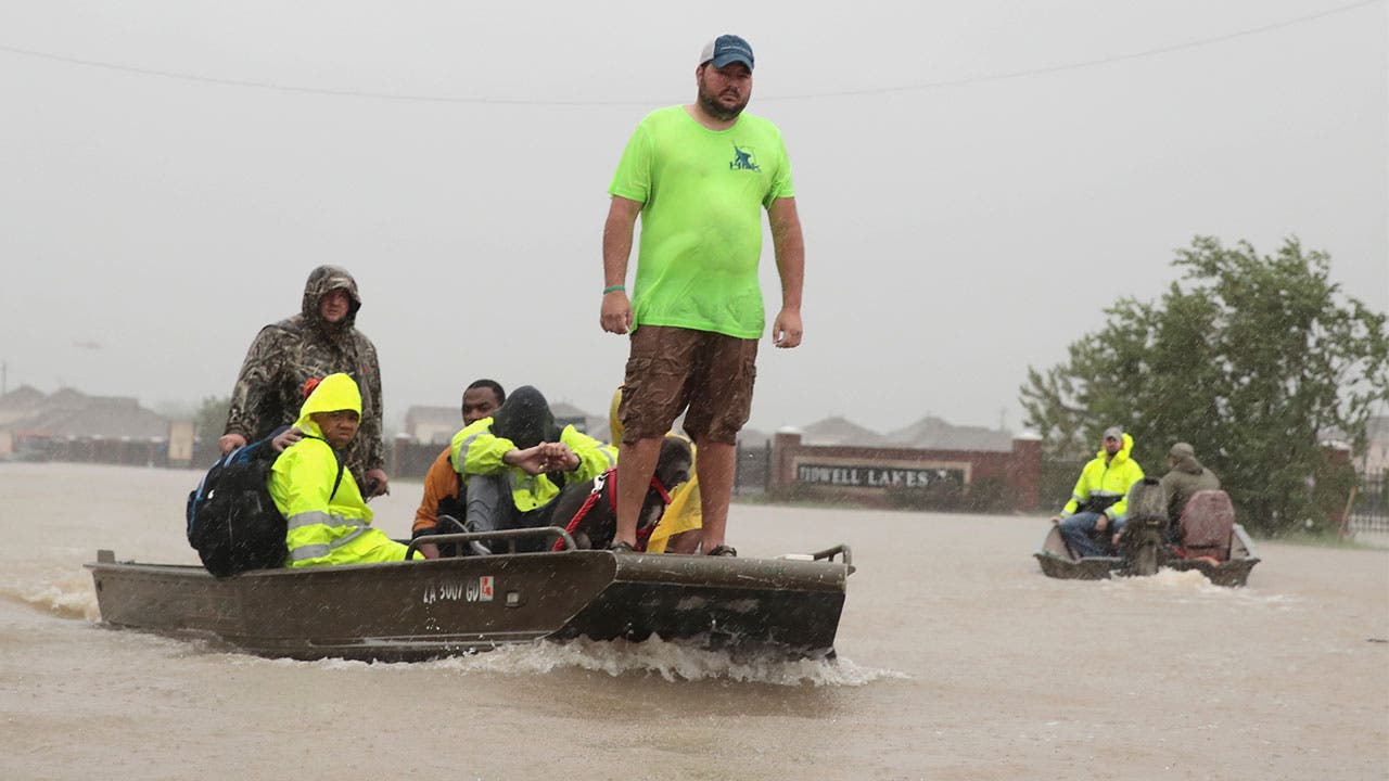 Hurricane Harvey floods have forced residents into boats