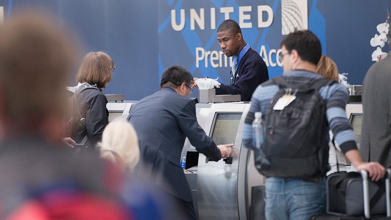 Passengers at United gate checking in