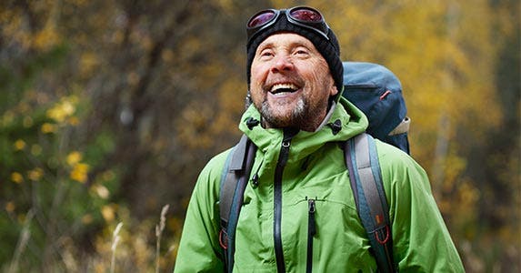 Hiker with backpack smiling